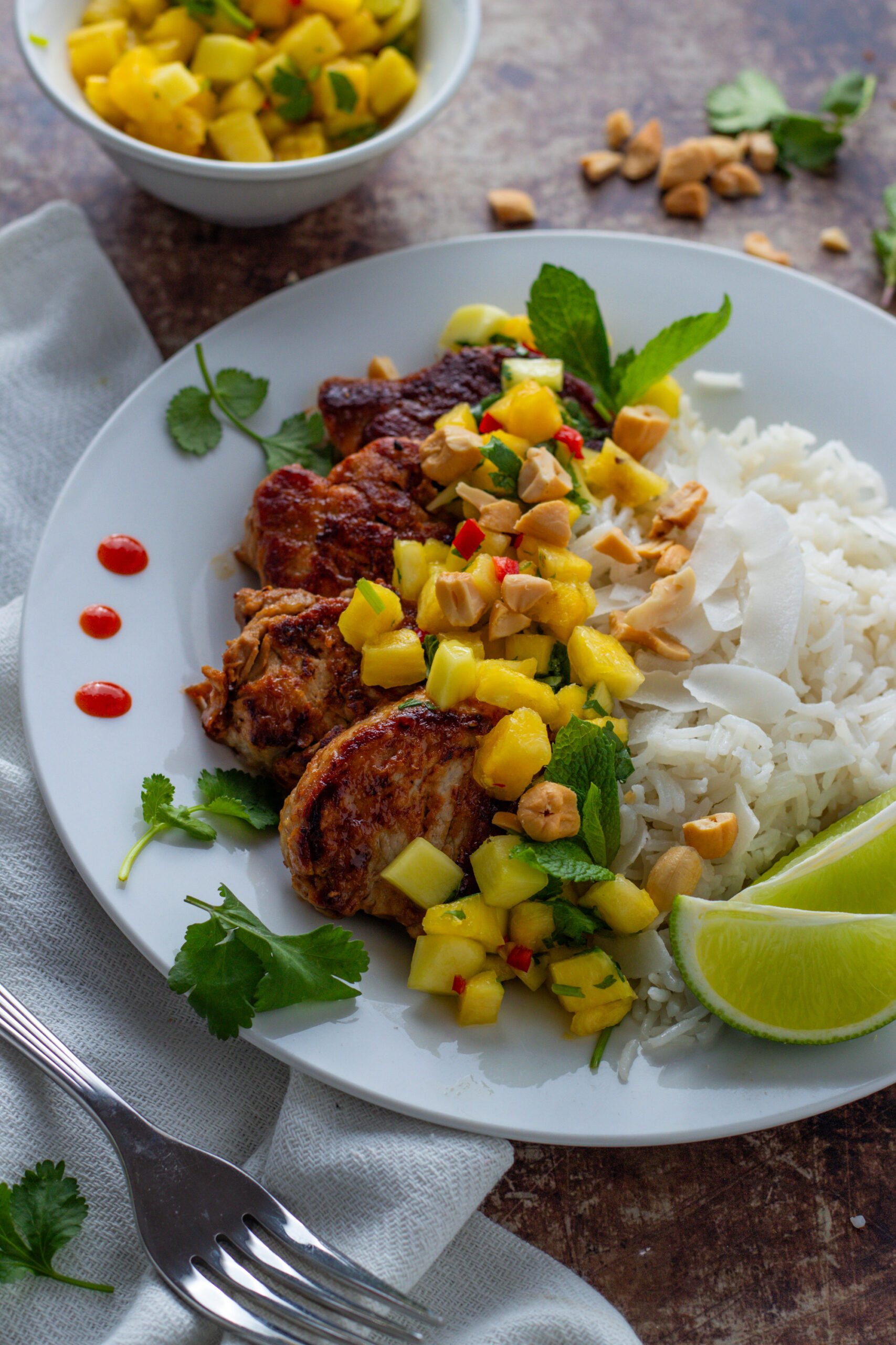 Pork tenderloin with pineapple salsa and basmati rice with fresh lime.