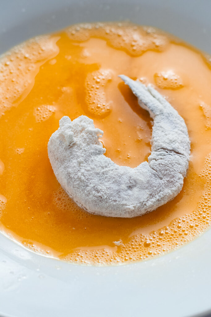 Floured prawn in egg.