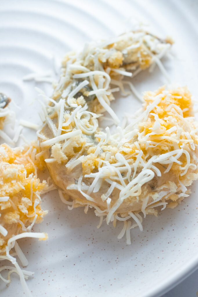 Prawn being crumbed in coconut and panko.