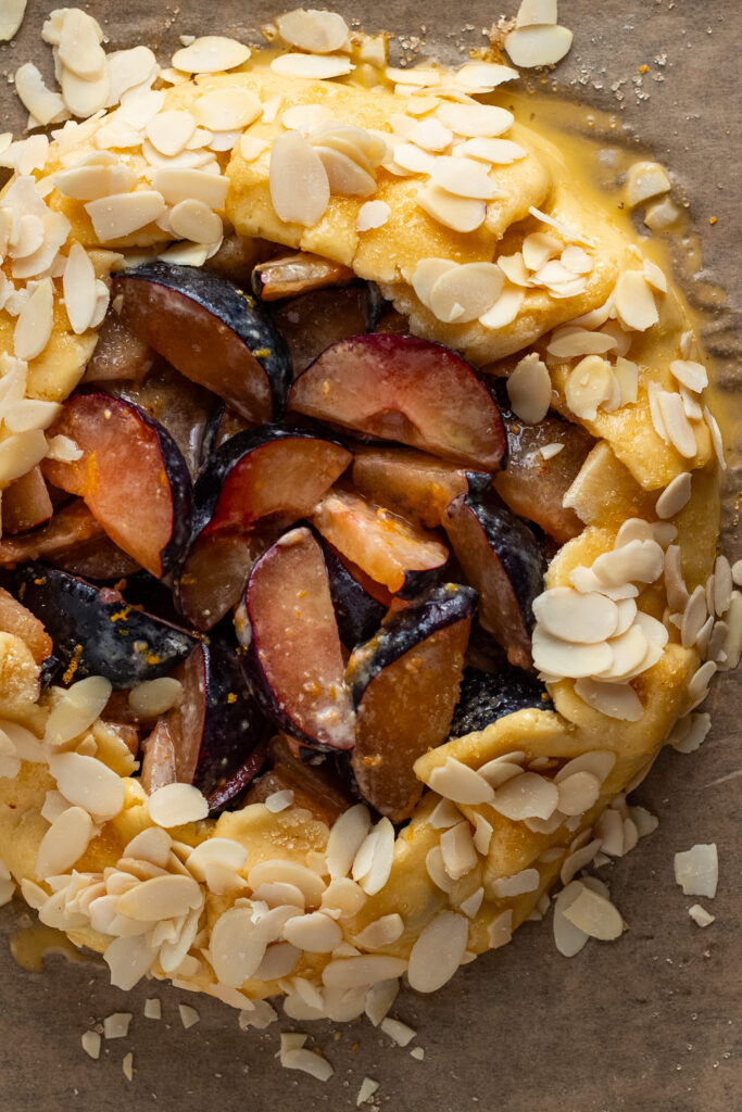 plums on pastry for plum galette.