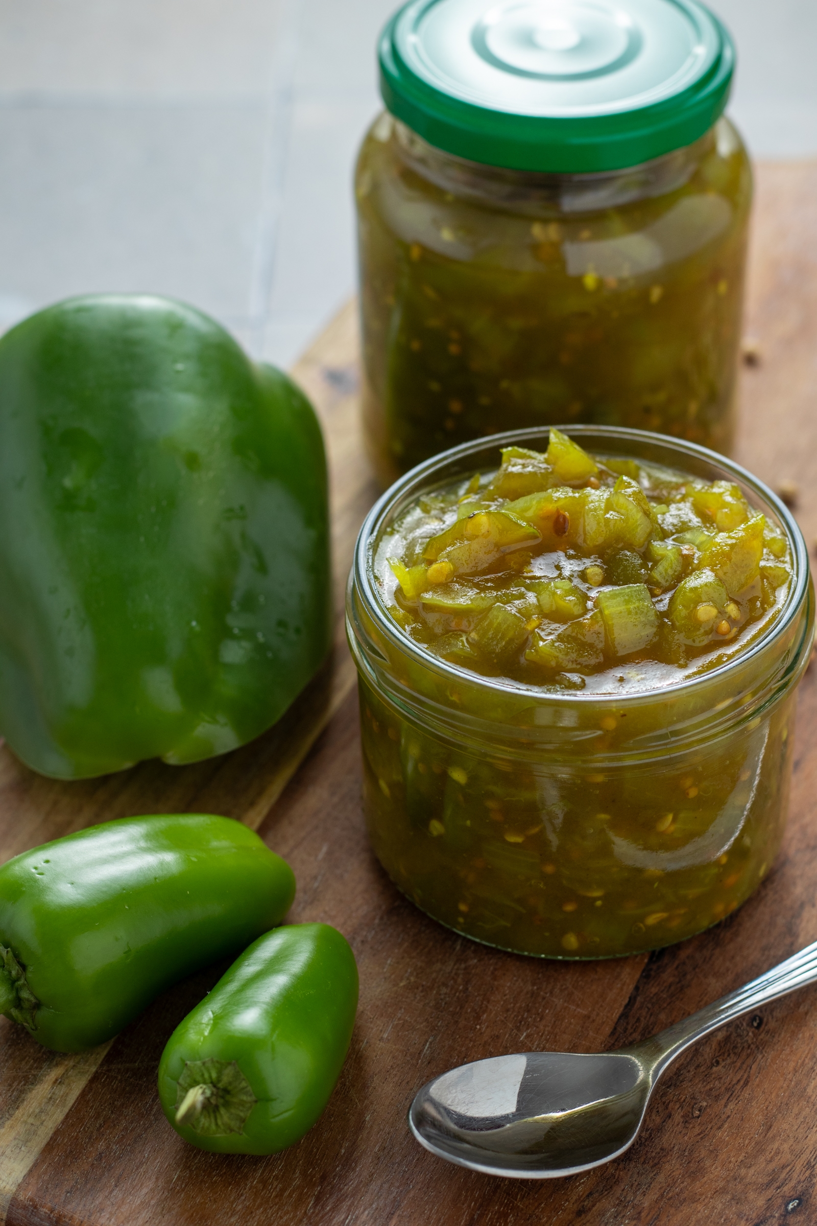 Green Tomato Relish in a jar with peppers.