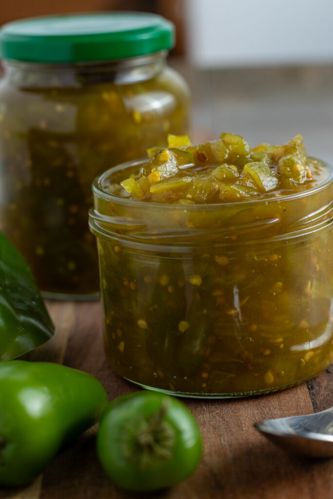 Green Tomato Relish in a jar with peppers.