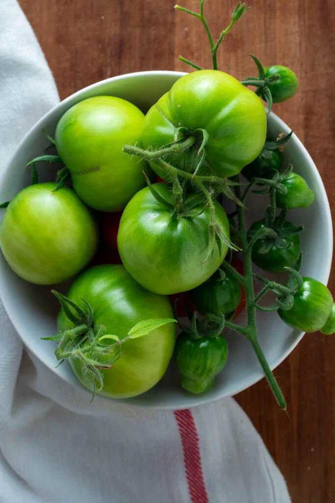 Green tomatoes in a bowl.